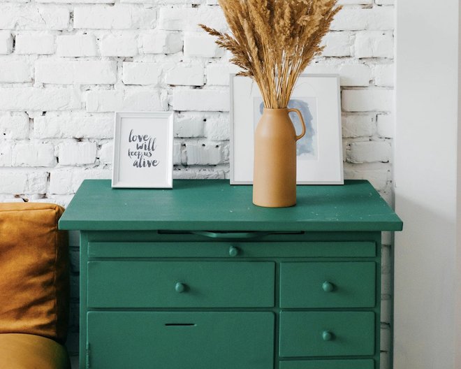 Drawers with a frame and a dried plant